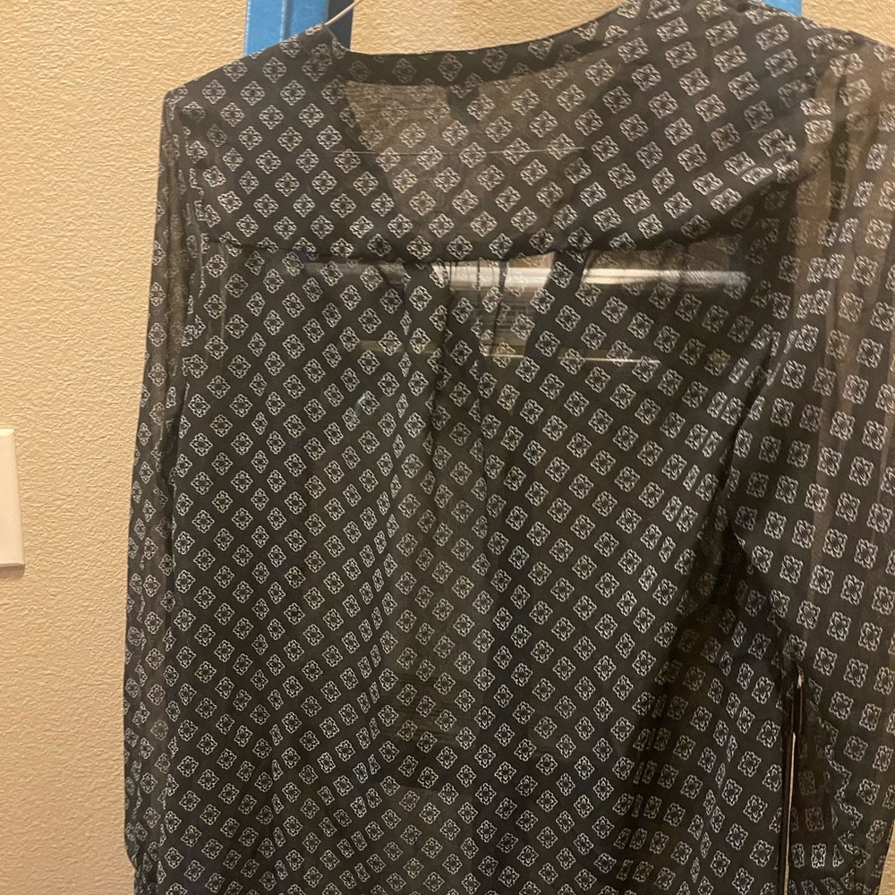 Sheer long sleeve blouse.